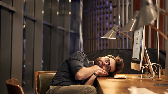 Tired Businessman Sleeping On Workplace. Workaholic Overtime Overworked In Internet At Deadline.