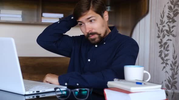 Young Man Freelancer Student Using Laptop Studying Online