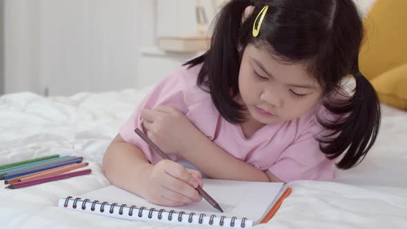 Asia japanese woman child kid relax rest fun happy draw cartoon in sketchbook