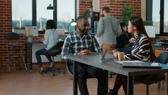 Asian Recruiter Interviewing Male Candidate About Job Offer