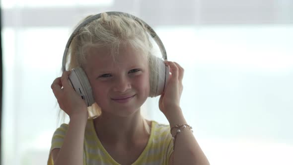 Portrait Beautiful Smiling Girl in Headphones