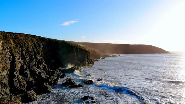 Beach with mountain cliff and sea 