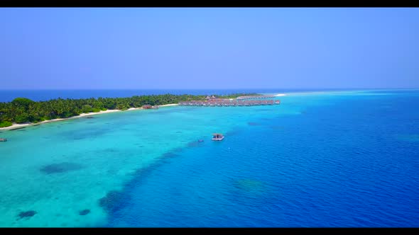 Aerial drone shot nature of idyllic tourist beach journey by blue sea with white sand background of 