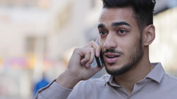 Hispanic Young Adult Businessman Talking Mobile Phone at Street Drinking Hot Coffee Tea