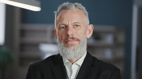 Confident Mature Grey Haired Man Employee Posing at Office Smiling to Camera Close Up