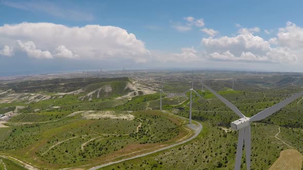 Flyover Above Green Fields With Wind Turbines, Alternative Energy, Aerial