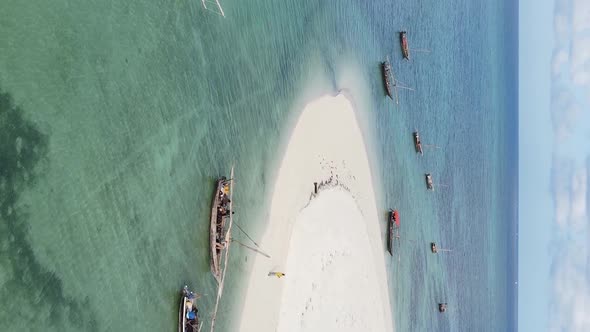 Tanzania Vertical Video  Boat Boats in the Ocean Near the Coast of Zanzibar Aerial View