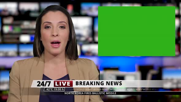 MS Female presenting breaking news from television studio