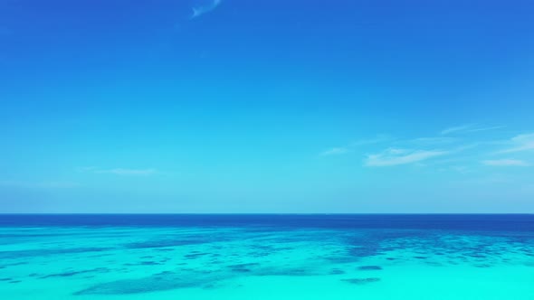 Tropical drone clean view of a white paradise beach and aqua blue ocean background in high resolutio