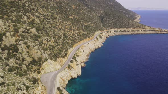 Aerial View of Curves Coastline Road Along Sea