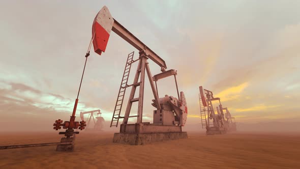 Loopable shot of oil pumps pumping oil on a field with god rays. Oil industry 4K