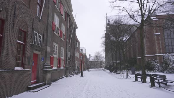 Point-of-view (POV) shot walking through snowy city streets, Leiden Netherlands