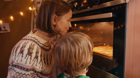 Family with Three Kids Cooking Ginger Cookies