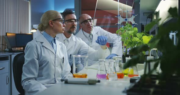 Scientists Using a Flat Transparent Display Screen alt