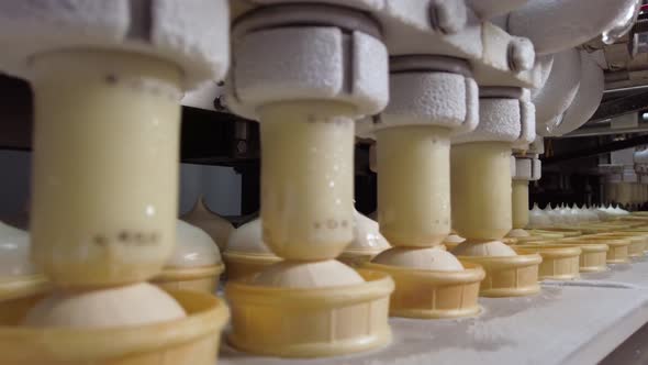 Ice Cream Production Line. Filling of Wafer Cups with Ice Cream. Ice Cream Factory