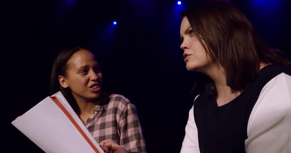 Teenagers rehearsing in a theatre alt
