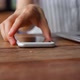 Woman grab smartphone from table and start browsing - VideoHive Item for Sale