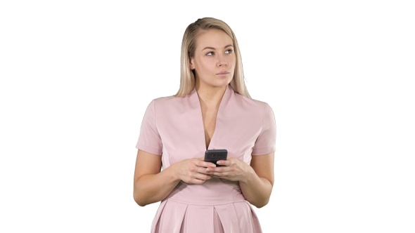 Portrait of smiling young lady reading text message on