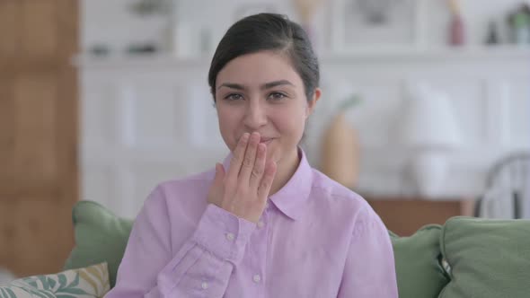 Portrait of Indian Woman Giving Flying Kiss