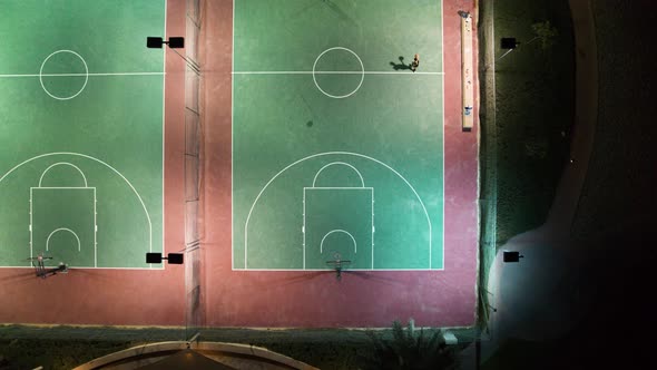 Aerial view of people playing at basketball court during the night, U.A.E.