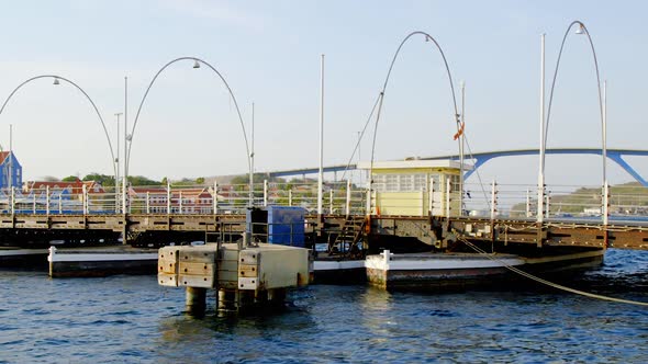 Yellow Control House In Queen Emma Bridge Over The St. Anna Bay In Punda, Curacao At Daytime. - stat