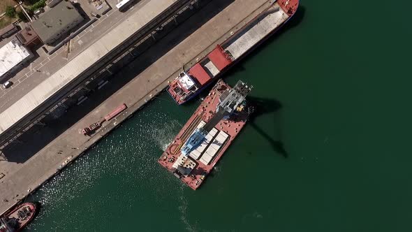 Ukraine  May 2016 Floating Crane Moves to Pier to Unload Oversized Cargo