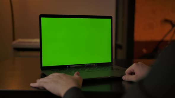 Faceless Man Greeting Colleagues at Online Call Via Laptop with Chromakey