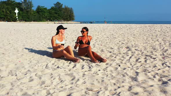 Girls tan on relaxing coast beach journey by blue sea and clean sand background of Koh Phangan near 