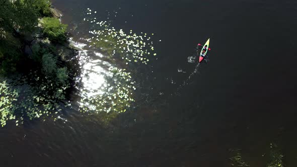 Aerial View From a Drone of a Person Who is Kayaking