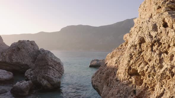 Huge Rocks in Blue Wavy Sea