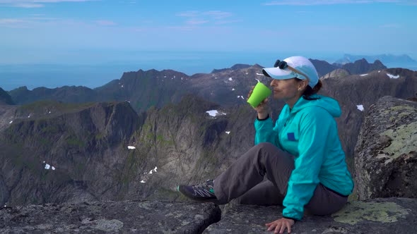 A Girl Is Drinking Tea in the Mountains