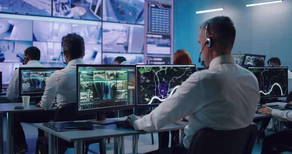 Male Trader Using Computer in Stock Exchange Office