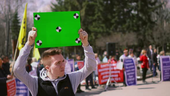 People on Political Riot Look. Chromakey Placard. Billboard with Motion Point 