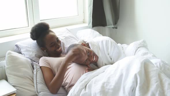 Black Man Is Listening To the Stomach of His Pregnant Wife.