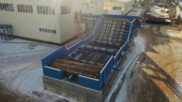 Aerial View of Automated Log Sorting Line. Wheel Loader and Automatic Sorting Logs Diameter at the