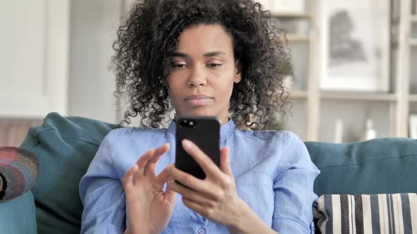 African Woman Using Smartphone Text Messaging