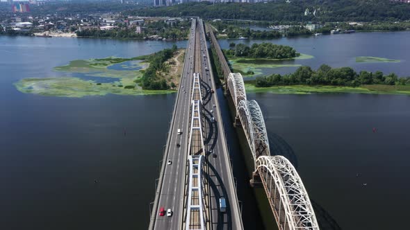 Traffic on the Darnytsky Bridge Over the River Dnipro in Kyiv - Aerial Shot