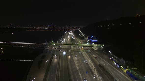 City Traffic Near the Metro Bridge in Kyiv at Night Aerial View
