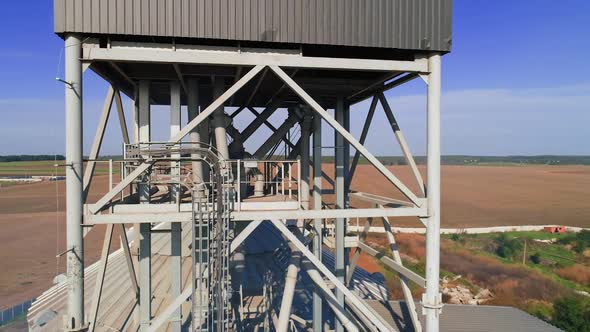 Granary grain elevators. Metal tanks for the storage crop. Large bins for farming.