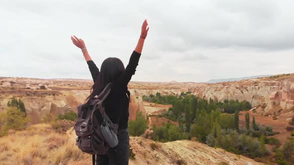 Excited Tourist Spread Hands In Scenic Location