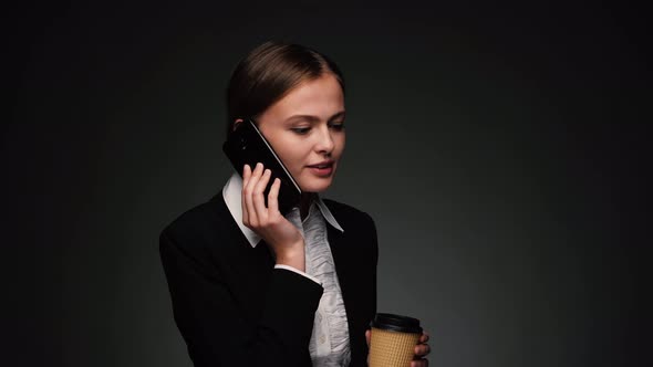 Brunette Businesswoman Talking on Phone and Smiling
