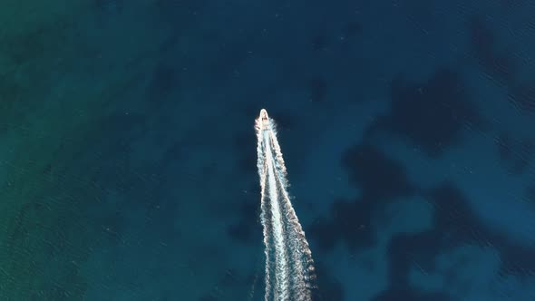 Overhead shot of white boat sailing in the open sea