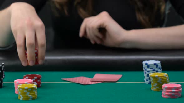 Lady Putting Won Chips on Equal Piles, Poker Tournament, Gambling and Casino