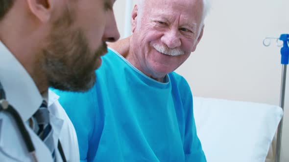 Doctor discussing treatment with old man