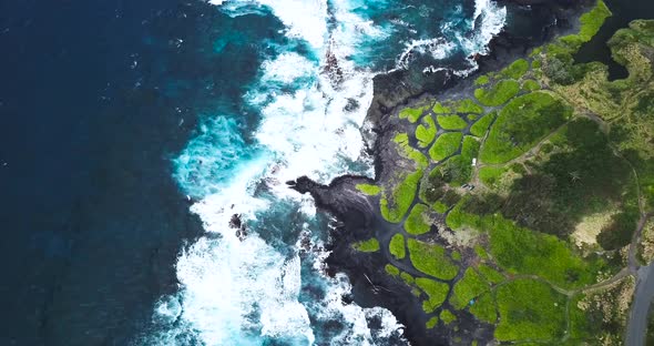 The Big Island of Hawai'i housing beautiful contrasts of black, green and blue, all shown from above