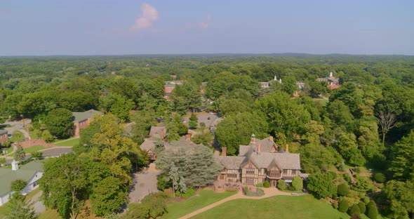 Flying Away From a Historic Mansion House Amongst Trees in Long Island