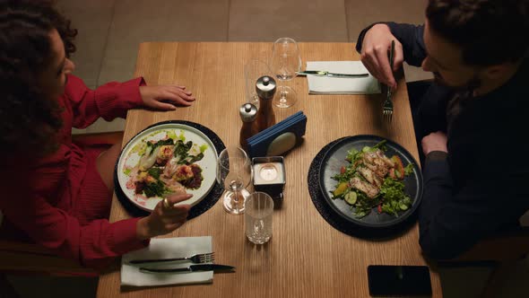 Two People Enjoy Dinner in Loft Restaurant