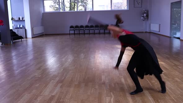 Slow motion professional and passionate female dancer does a flip over on her hands