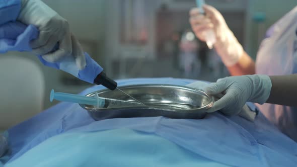 Doctor and nurse preparing for surgery