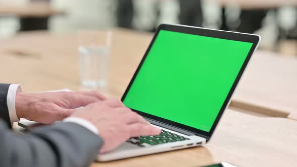 Businessman Working on Laptop with Chroma Screen 